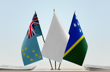 Flags of Tuvalu and Solomon Islands with a white flag in the middle