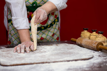 Female hands making dough for pizza. Making bread. Cooking Process Concept