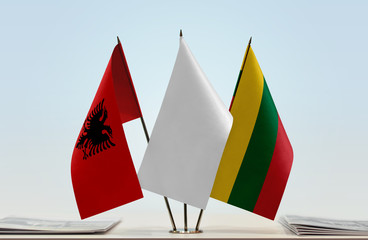 Flags of Albania and Lithuania with a white flag in the middle