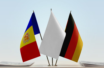 Flags of Andorra and Germany with a white flag in the middle