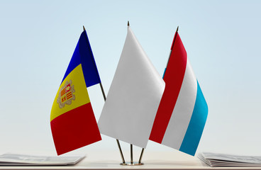 Flags of Andorra and Luxembourg with a white flag in the middle
