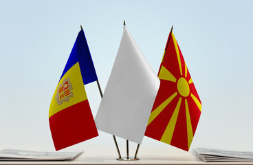 Flags of Andorra and Macedonia with a white flag in the middle