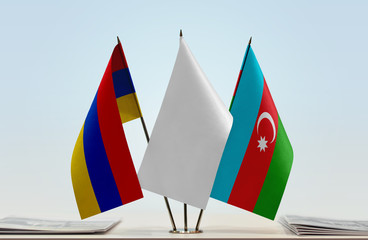 Flags of Armenia and Azerbaijan with a white flag in the middle