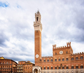 Fototapeta na wymiar Campo Square with Mangia Tower in Siena, Italy