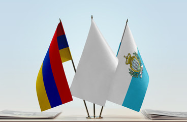 Flags of Armenia and San Marino with a white flag in the middle