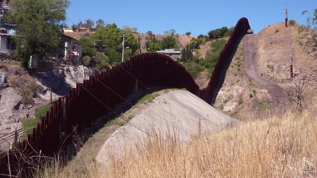 A view along the US Mexico border wall at Nogales, Arizona.