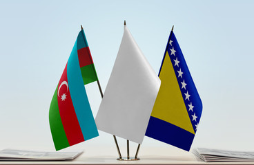 Flags of Azerbaijan and Bosnia and Herzegovina with a white flag in the middle