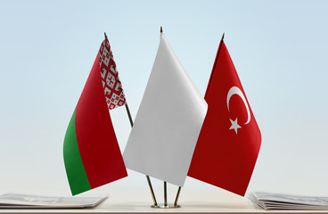 Flags of Belarus and Turkey with a white flag in the middle