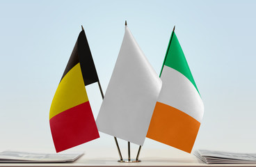 Flags of Belgium and Ireland with a white flag in the middle