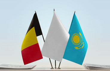 Flags of Belgium and Kazakhstan with a white flag in the middle