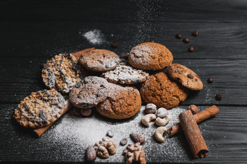 Homemade cookies dessert. Chocolate chip, oatmeal raisin, dough and nuts. Copy text menu food background.