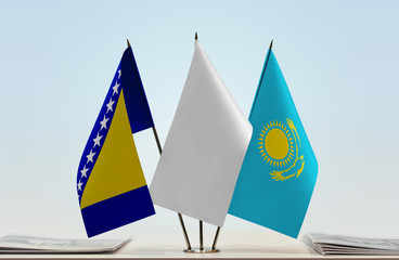 Flags of Bosnia and Herzegovina and Kazakhstan with a white flag in the middle