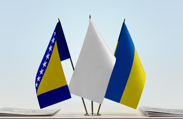 Flags of Bosnia and Herzegovina and Ukraine with a white flag in the middle