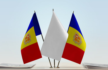 Two flags of Andorra with a white flag in the middle