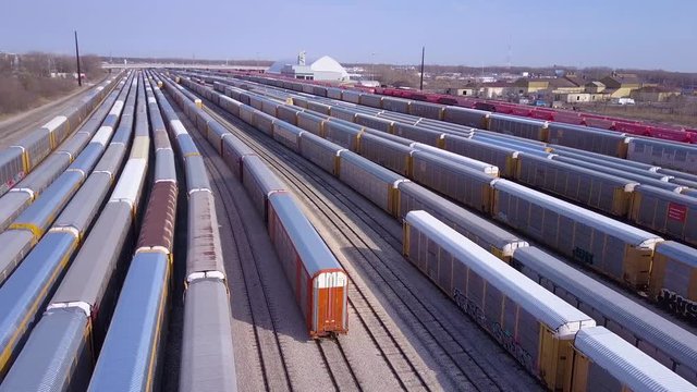 A good aerial over a railroad yard suggests shipping, commerce, trade or logistics.