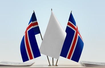 Fototapeta na wymiar Two flags of Iceland with a white flag in the middle