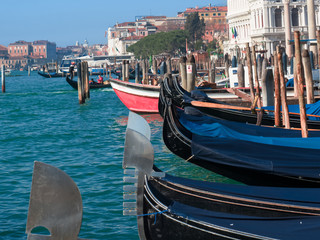 Fototapeta na wymiar Venice cityscape with gondelas moored on the Grand Canal. Italy