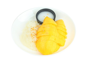 Ripe golden mango with green and white of sticky rice.