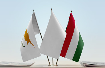 Flags of Cyprus and Hungary with a white flag in the middle