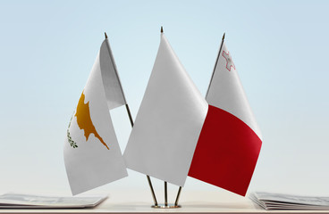 Flags of Cyprus and Malta with a white flag in the middle