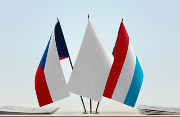 Flags of Czech Republic and Luxembourg with a white flag in the middle