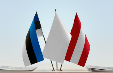 Flags of Estonia and Austria with a white flag in the middle