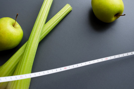 celery, apples and measuring tape