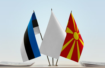 Flags of Estonia and Macedonia with a white flag in the middle