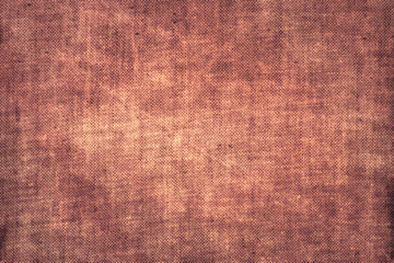 Fototapeta premium Scratched coarse old burlap rusty pink red natural canvas sacking fabric texture
