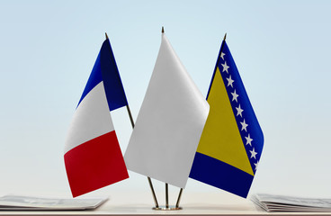 Flags of France and Bosnia and Herzegovina with a white flag in the middle