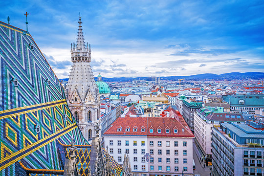 Lovely view from above of Vienna - the capital of Austria, European country. Iconic landmark and extremely popular European travel destination. View over roofs on classic architecture, day scenery.