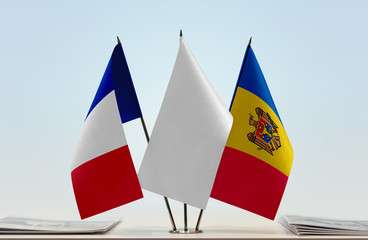 Flags of France and Moldova with a white flag in the middle