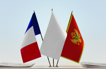 Flags of France and Montenegro with a white flag in the middle