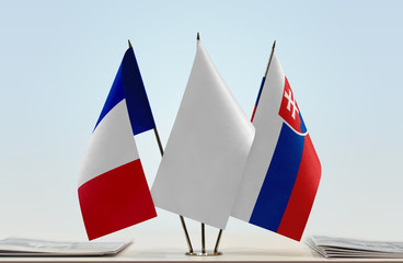 Flags of France and Slovakia with a white flag in the middle