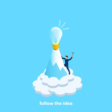 a man in a business suit rises to the top of the mountain for a bulb symbolizing the idea, an isometric image