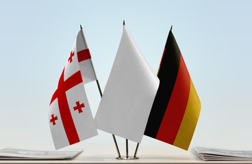 Flags of Georgia (country) and Germany with a white flag in the middle