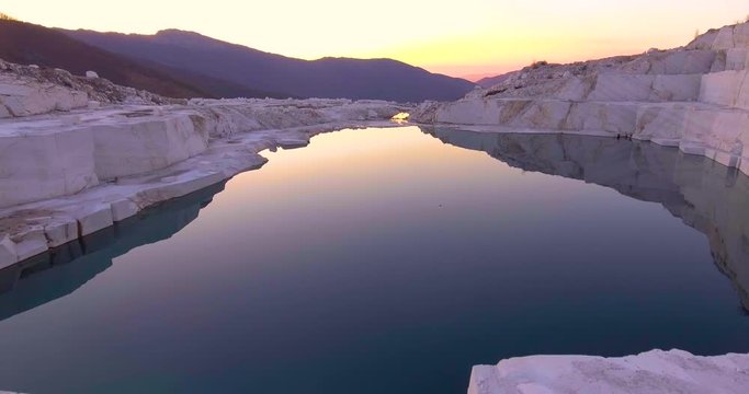 Beautiful aerial over a marble quarry at dawn.