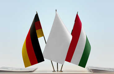 Flags of Germany and Hungary with a white flag in the middle