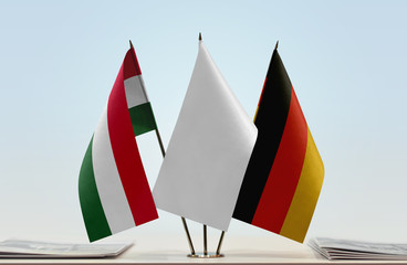 Flags of Hungary and Germany with a white flag in the middle