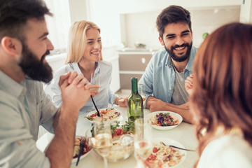 Friends having lunch at home