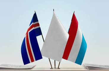 Flags of Iceland and Luxembourg with a white flag in the middle