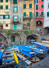 Fototapeta na wymiar View on the colorful houses along the coastline of Cinque Terre area in Riomaggiore