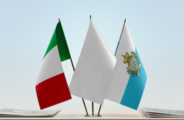 Flags of Italy and San Marino with a white flag in the middle