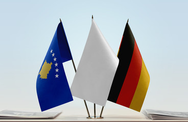 Flags of Kosovo and Germany with a white flag in the middle