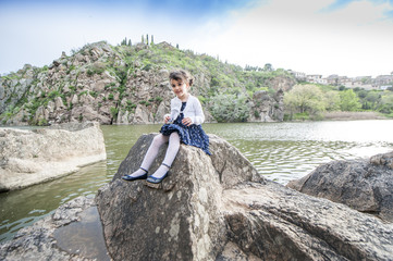 Fototapeta na wymiar Little girl posing in the park