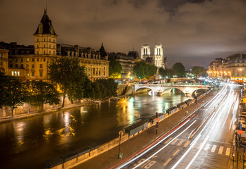 Fototapeta na wymiar Pont Saint-Michel and Quai des Grands Augustins at Night