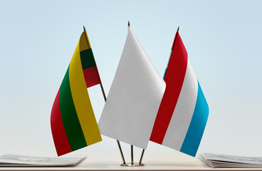Flags of Lithuania and Luxembourg with a white flag in the middle