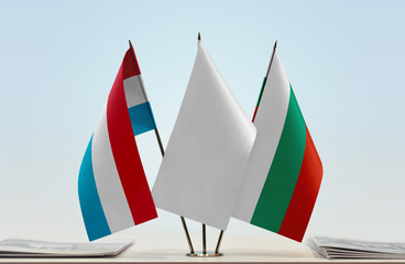 Flags of Luxembourg and Bulgaria with a white flag in the middle