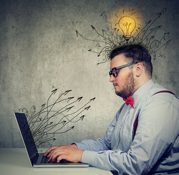 business man working on laptop has bright ideas