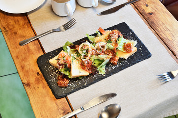  Mexican seafood salad on black slate plate 